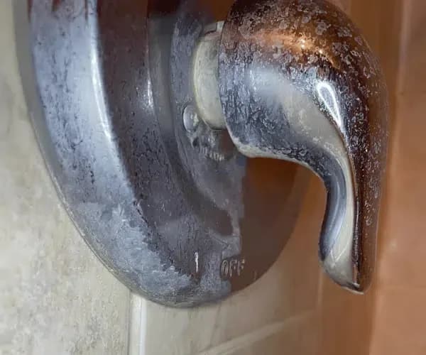 Shower faucet before cleaning